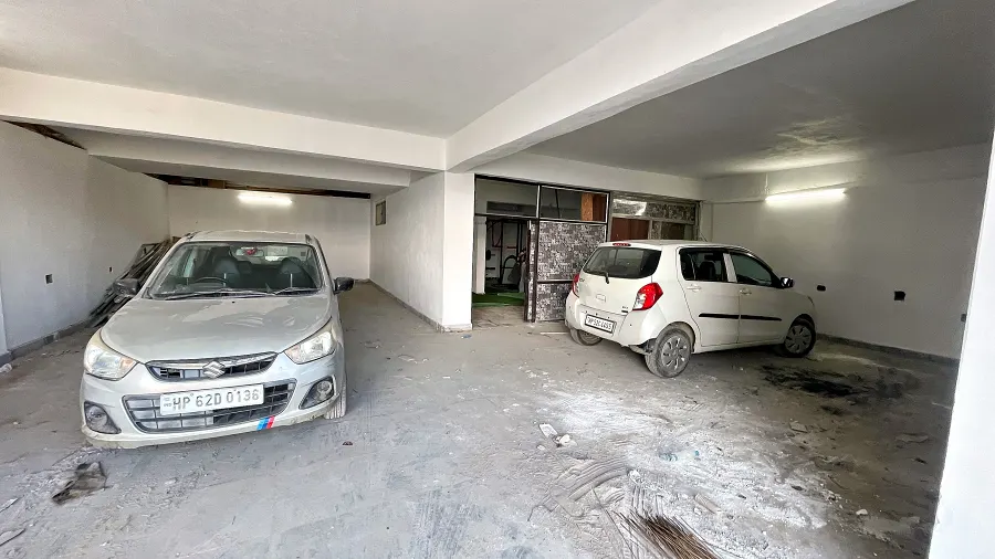 Covered parking beneath the villa with room for several cars
