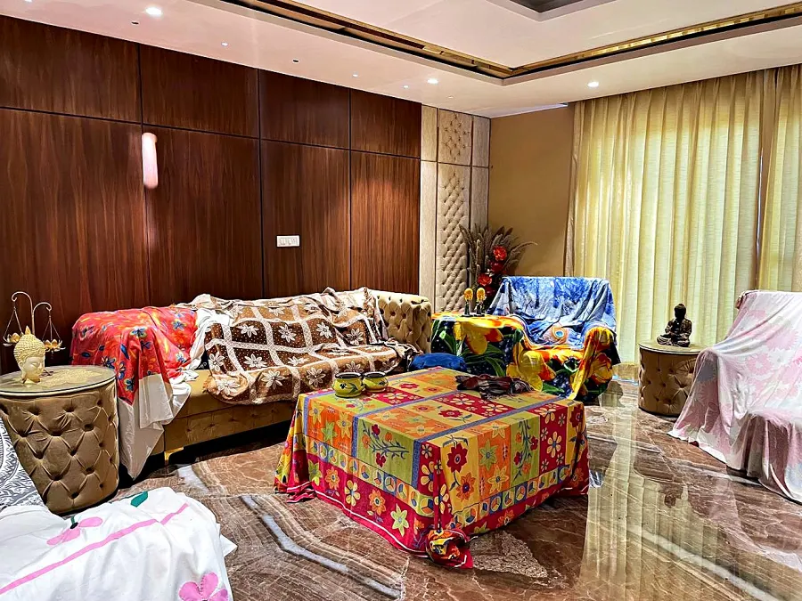Mountain View bedroom with a patterned throw across the bed and a seating corner by the window